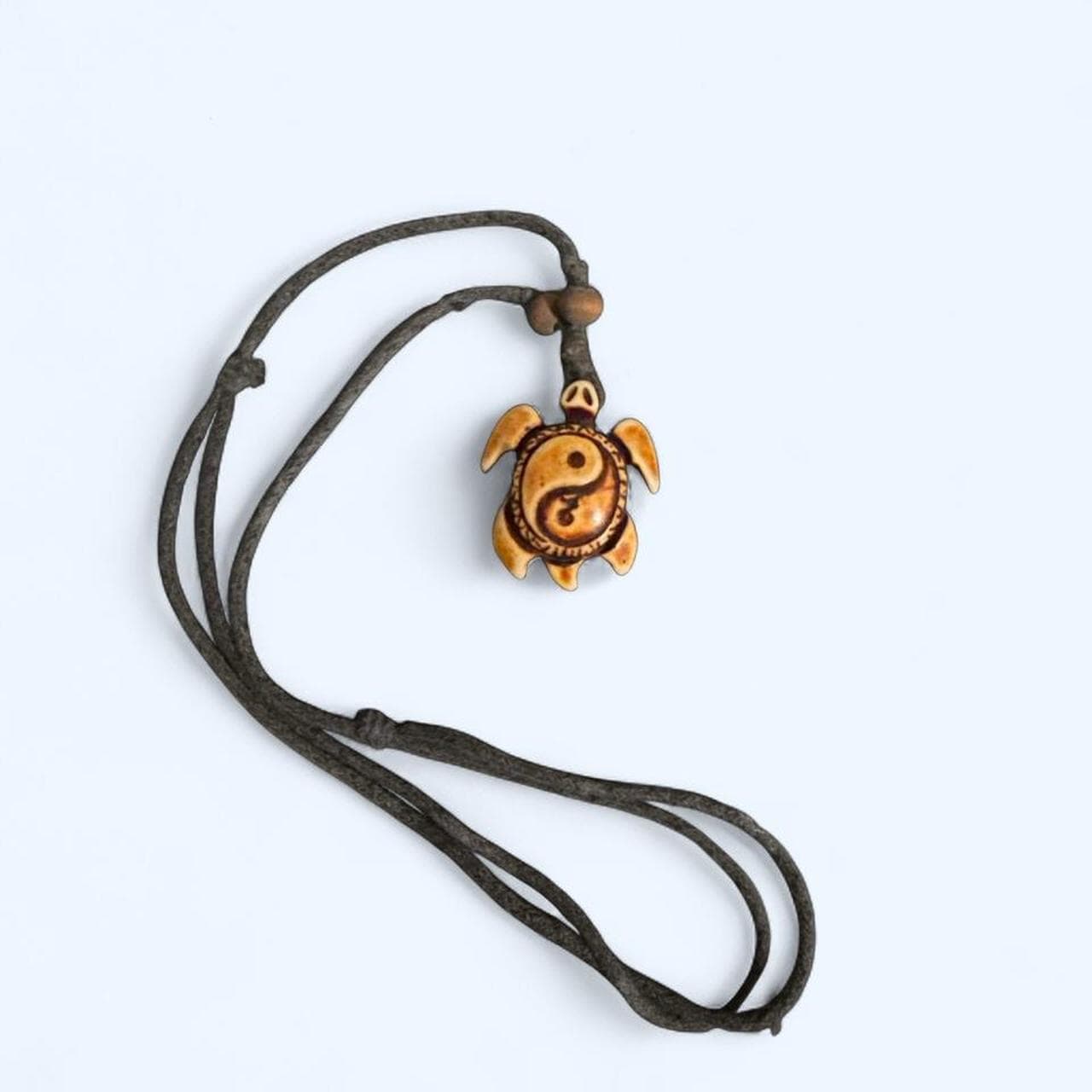 Boho turtle yin-yang necklace — carved, adjustable cord